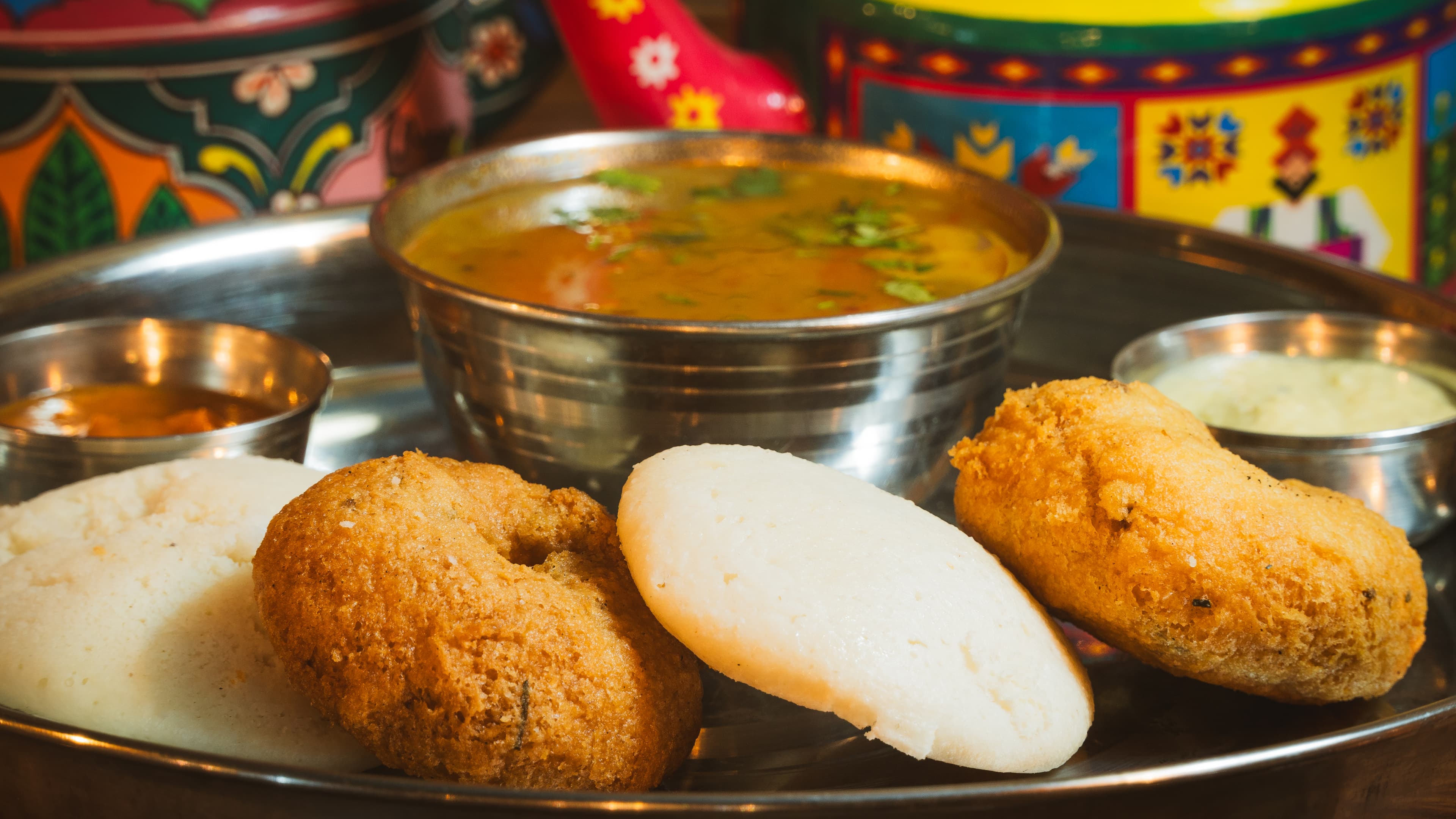 Idli and vada with hot sambar and coconut chutney